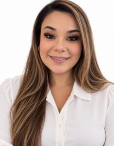 Ashley wearing a white outfit
